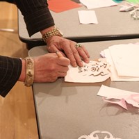 Cutting Paper Portraits of Strangers: from Subway to Classroom