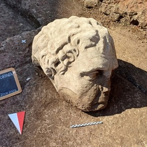 Archaeologists in Rome unearth a Large Marble Head beneath Trajan’s Forum