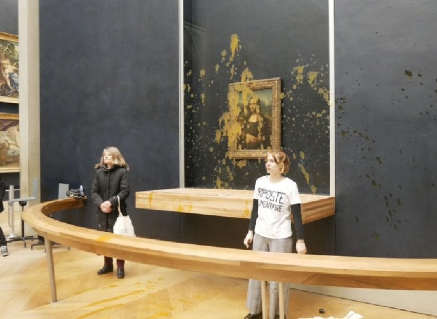 Eco-Idiots attack the Mona Lisa in the Louvre by throwing Soup at Da Vinci's Painting